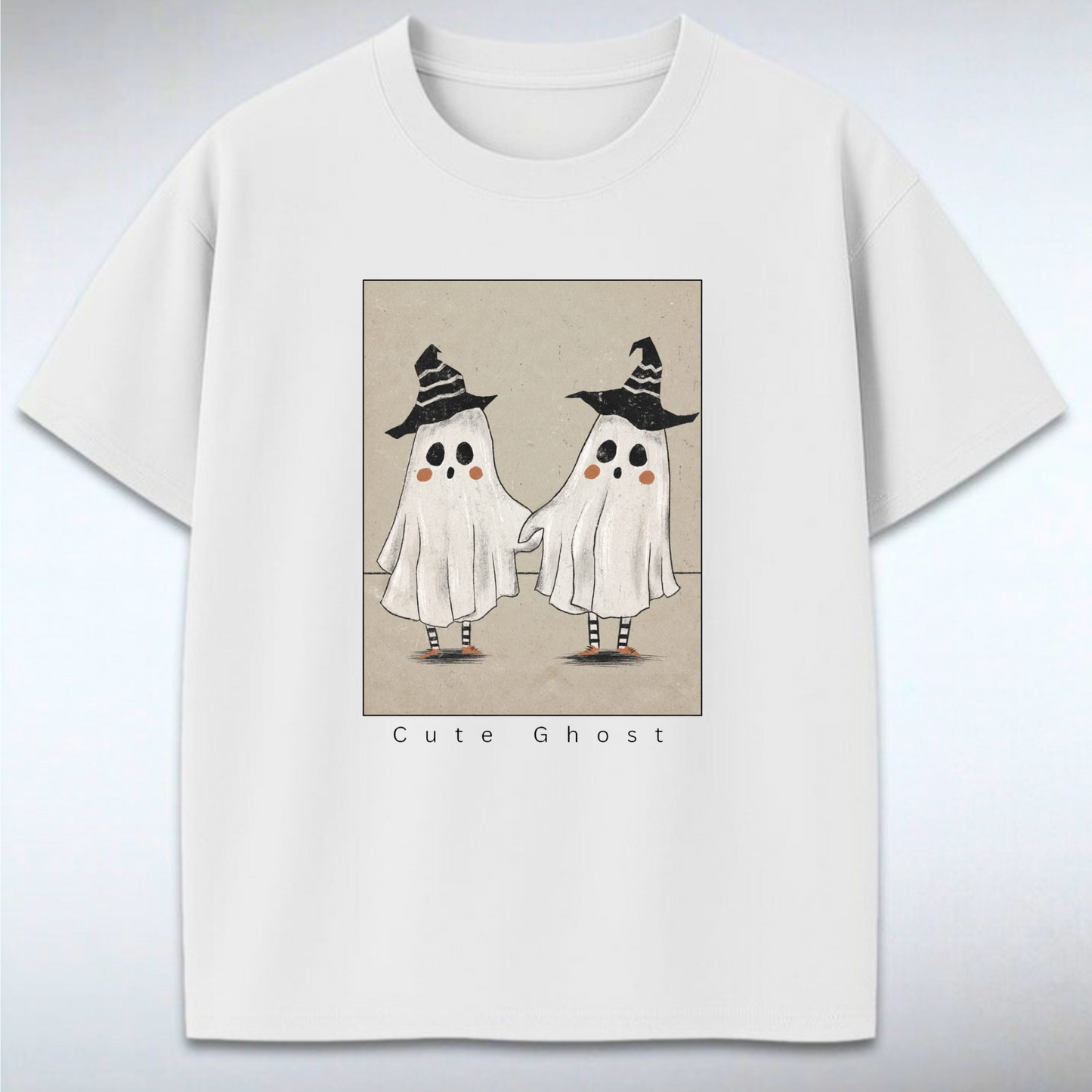 White t-shirt with cute ghost design on a gray background