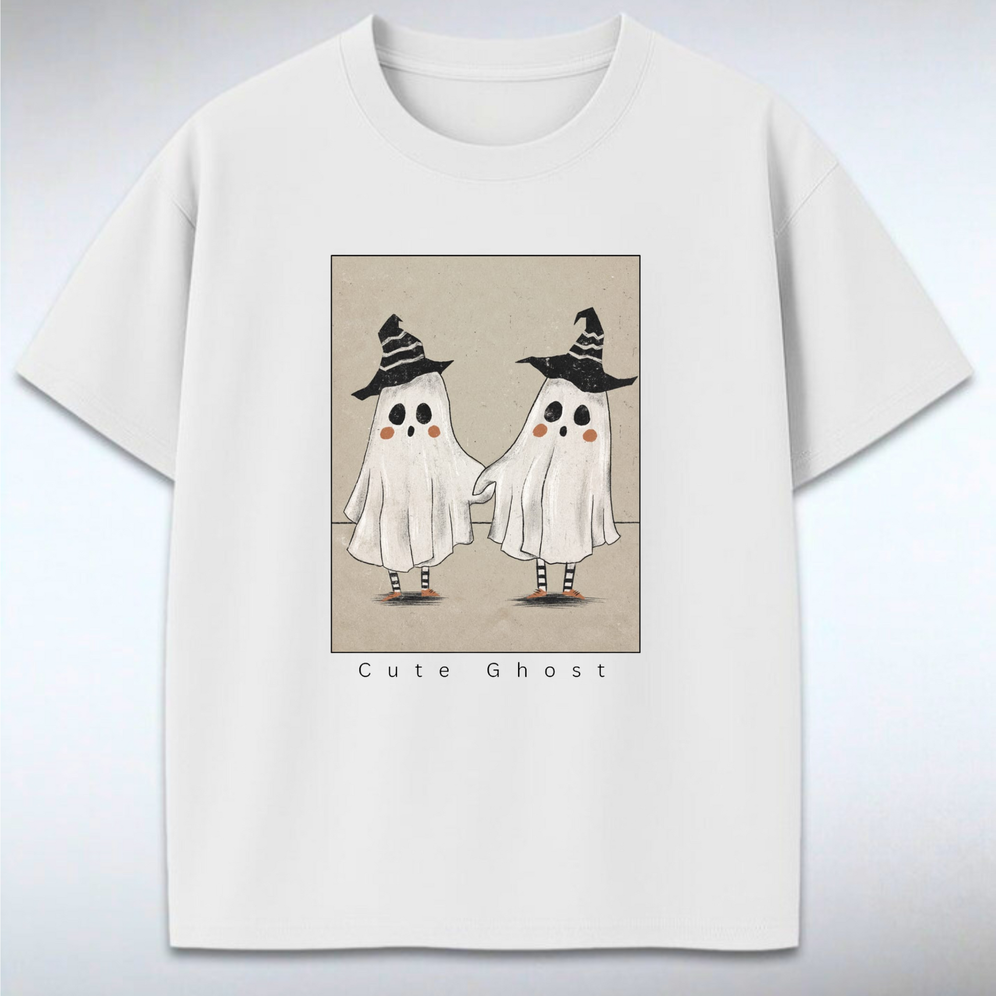 White t-shirt with cute ghost design on a gray background