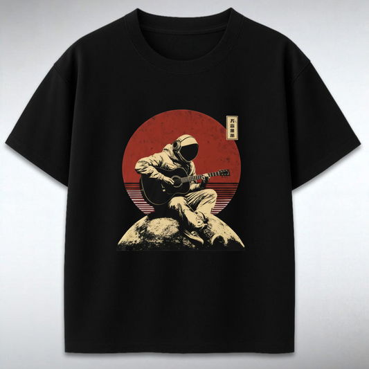 Black t-shirt with a graphic of a person playing guitar on a rock against a red sun backdrop.