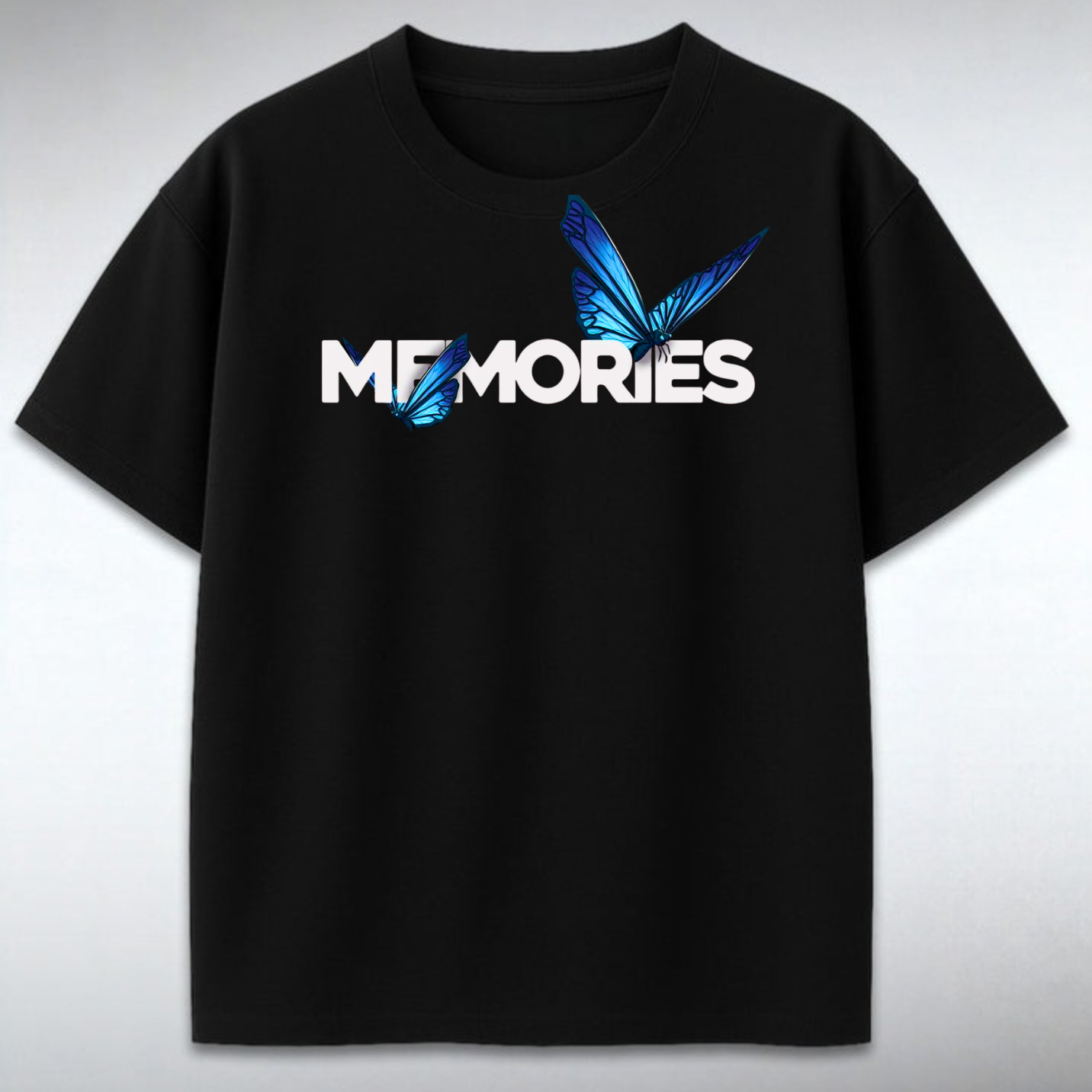 Black t-shirt with 'MEMORIES' and butterfly design on a gray background