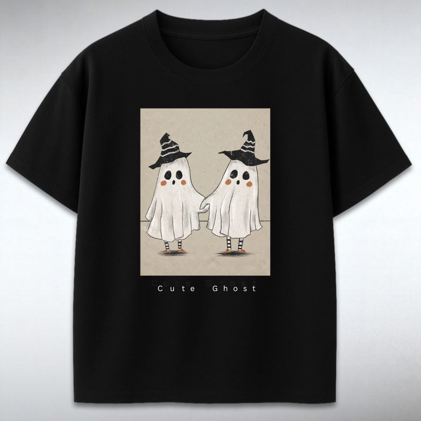 Black t-shirt with cute ghost design on a gray background