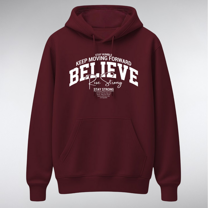 A heavyweight pullover hoodie featuring a collegiate-style chest graphic. The word "BELIEVE" is arched in large white serif letters, overlaid with "Rise Strong" in script, and surrounded by small text reading "KEEP MOVING FORWARD" and "STAY STRONG.