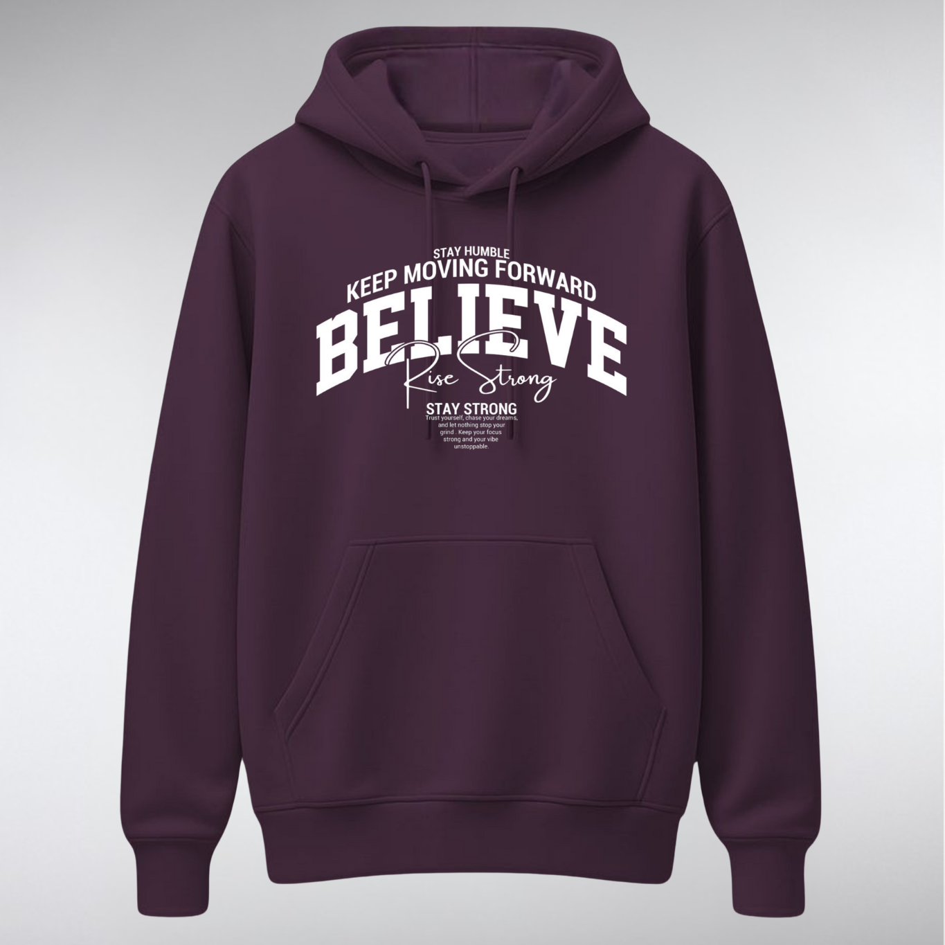 A heavyweight pullover hoodie featuring a collegiate-style chest graphic. The word "BELIEVE" is arched in large white serif letters, overlaid with "Rise Strong" in script, and surrounded by small text reading "KEEP MOVING FORWARD" and "STAY STRONG.